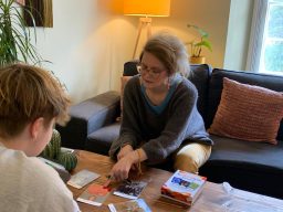 Lorraine in a therapy session with a teenager, using emotion cards