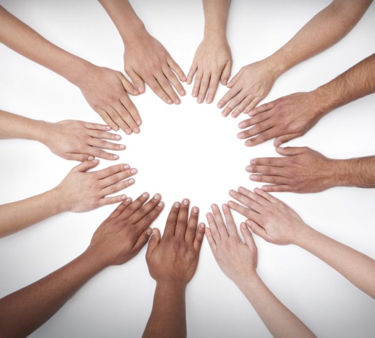 Multiple pairs of hands, touching each other and making a whole circle